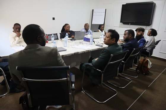 Dream71 and AIC/UNDP counterparts around the table for the UAIS data architecture and insurance portfolio review.