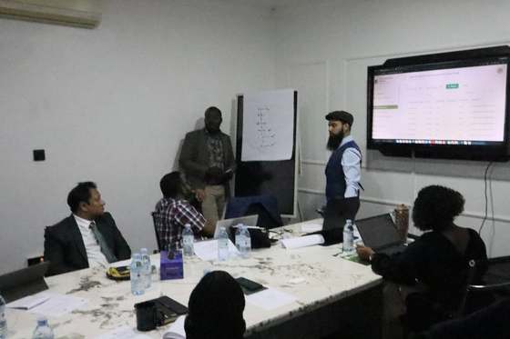 A module walkthrough during the presentation to MoFPED, IRA, BoU and other anchor partners.