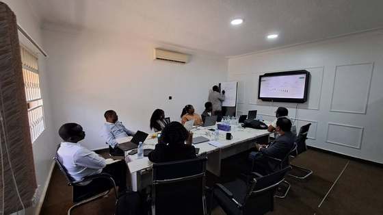 Back at the AIC office with partners, discussing how to collect and feed district-level data into the platform.